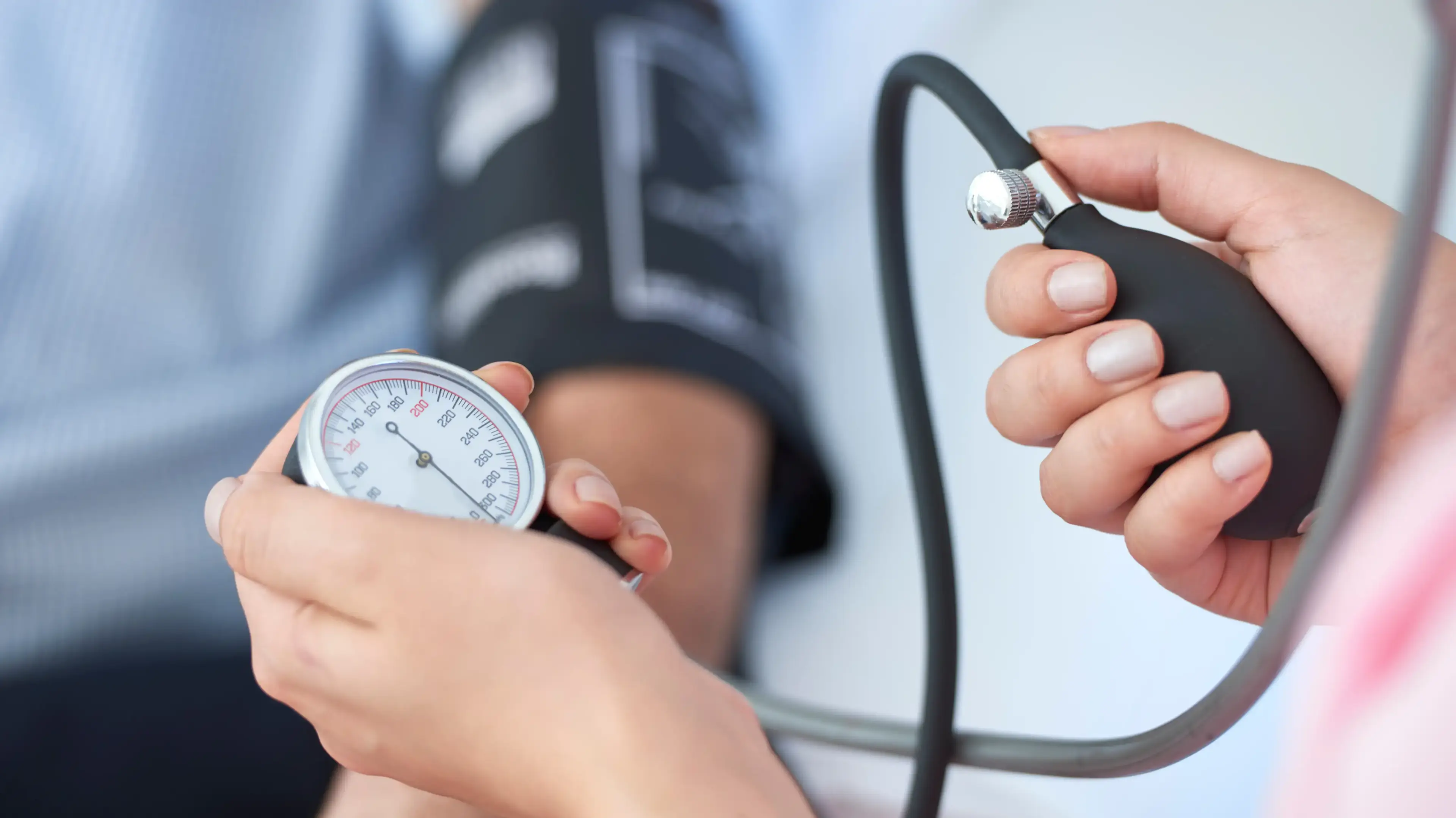 Adult having their blood pressure checked