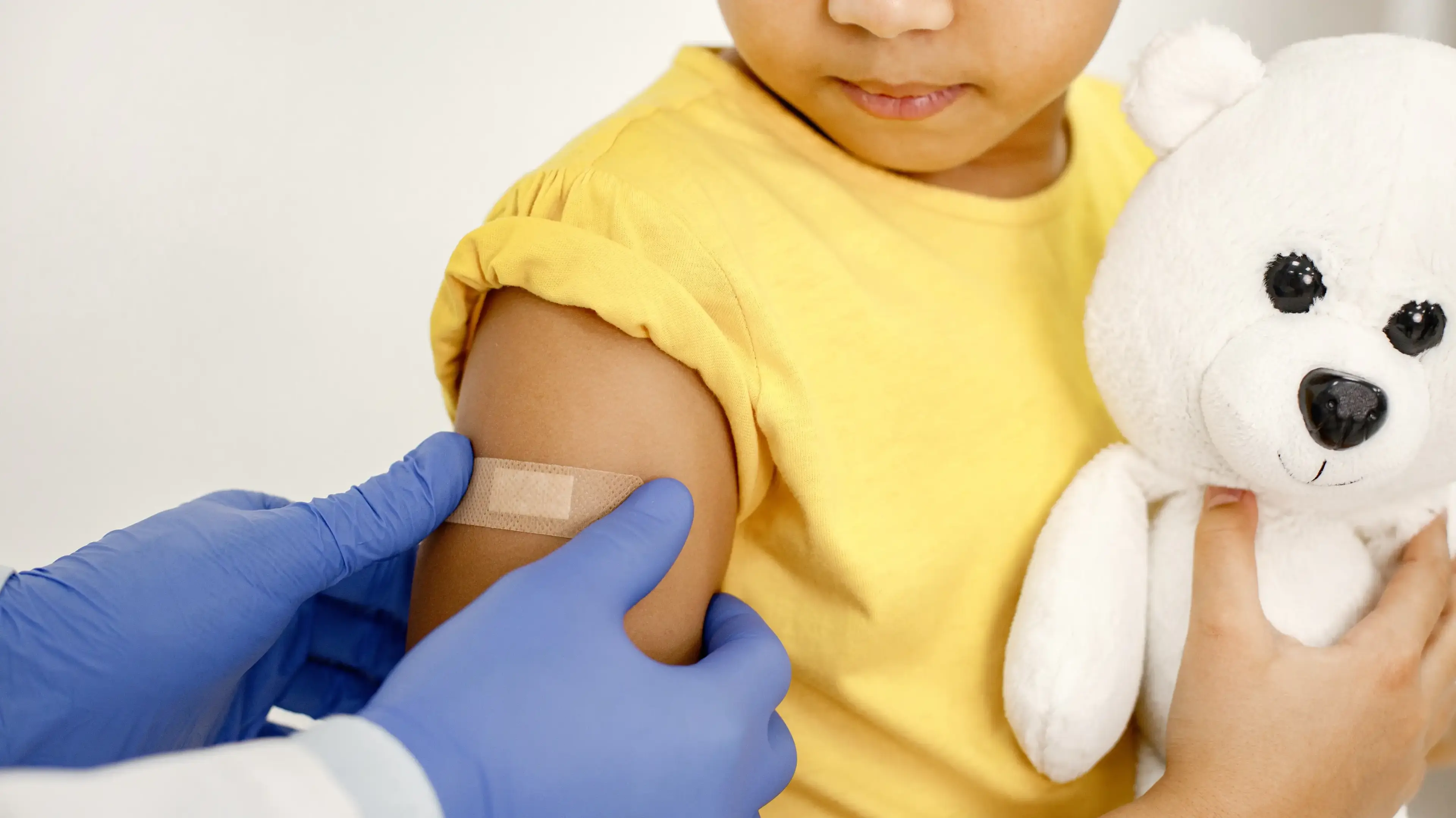 Child receiving an immunization during a pediatric visit