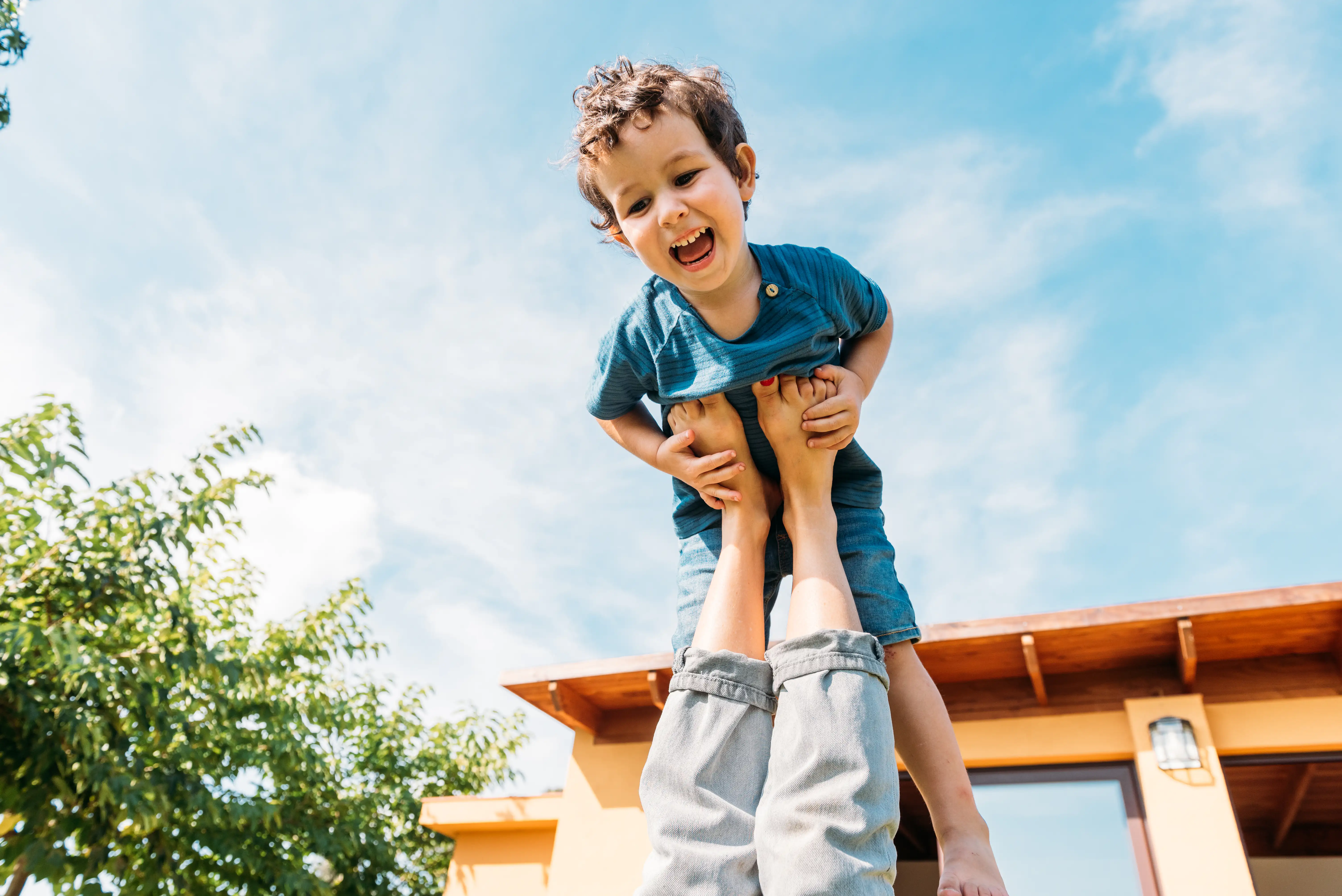 Smiling child playing actively outdoors